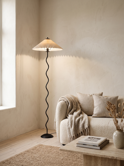 Dune floor lamp beside a boucle sofa in a Scandinavian living room