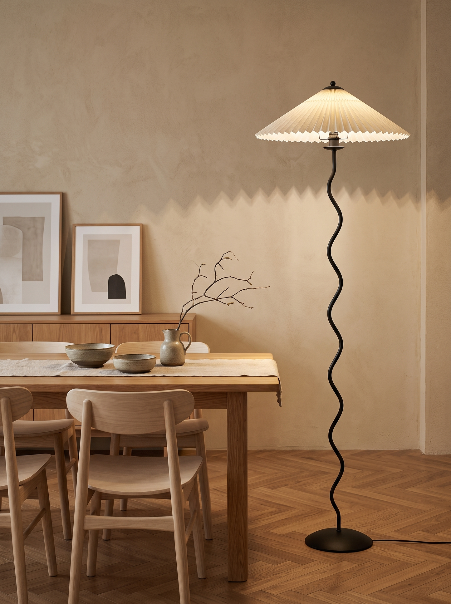 Dune floor lamp beside an oak dining table