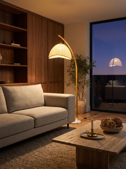 Suna floor lamp in an open-plan living room at night