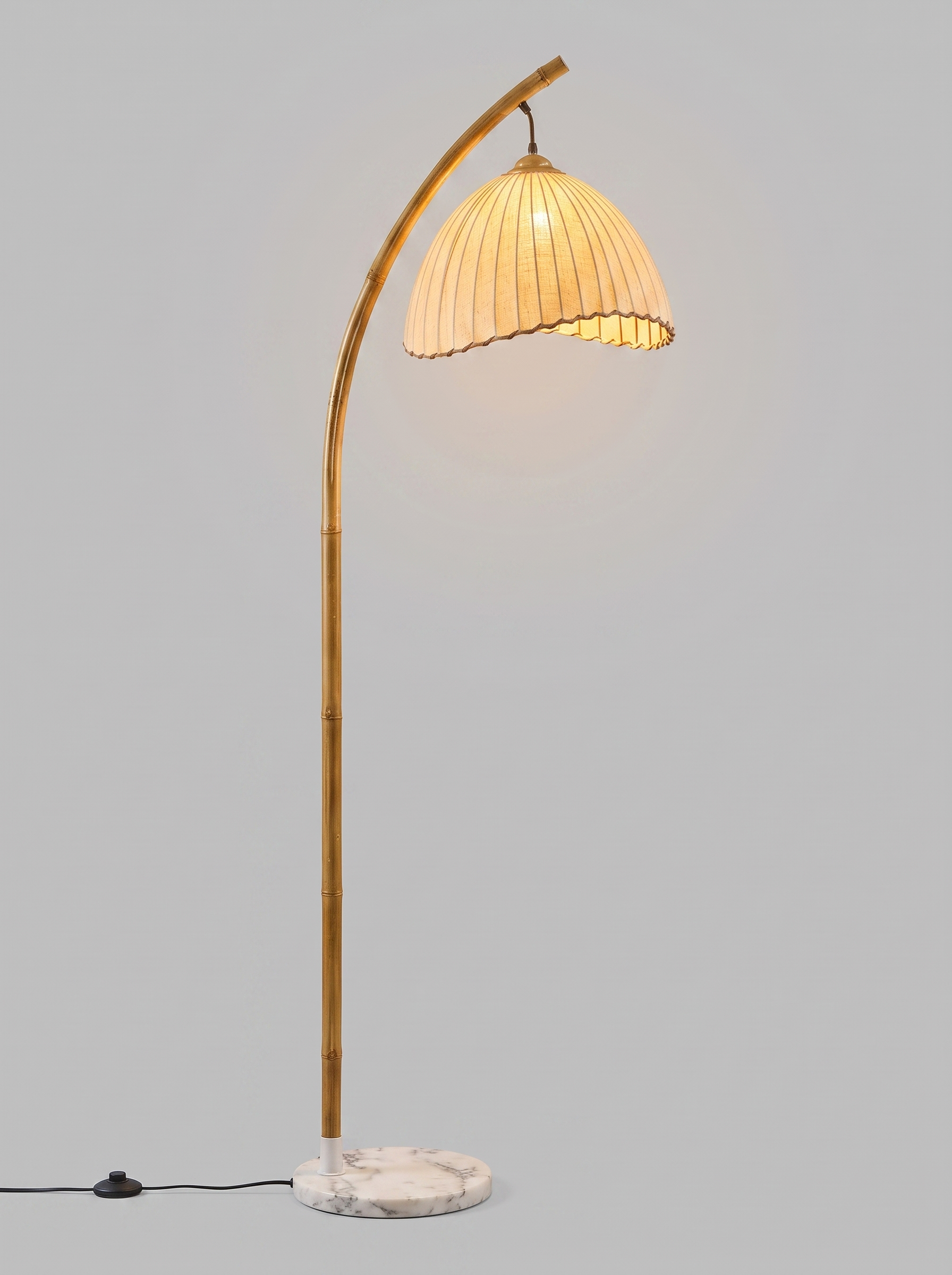 Suna bamboo and fabric floor lamp, studio view, lit
