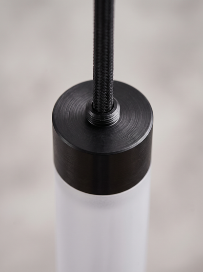 Macro detail of the anodised aluminium top cap and cord