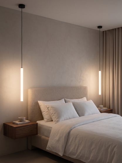 Pair of Filo pendants beside a bed as bedside lighting