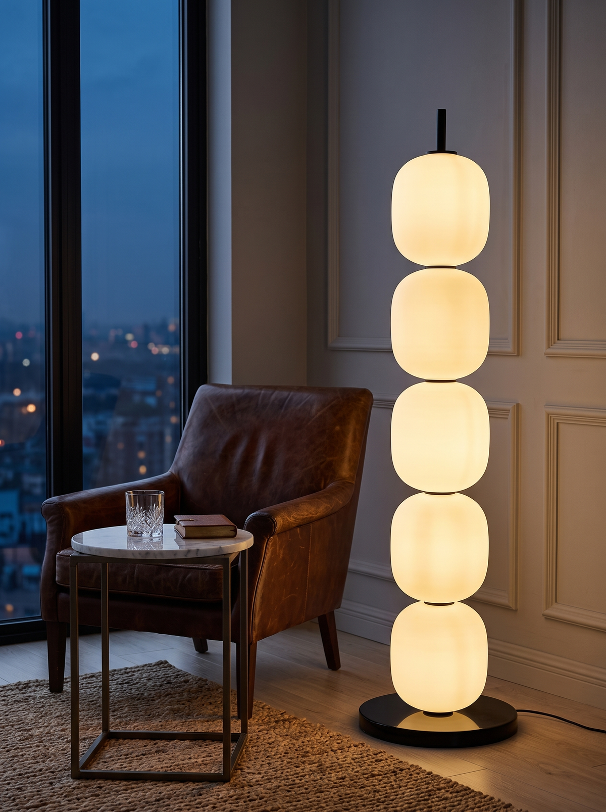 Sasso floor lamp in a hotel-suite style corner at dusk