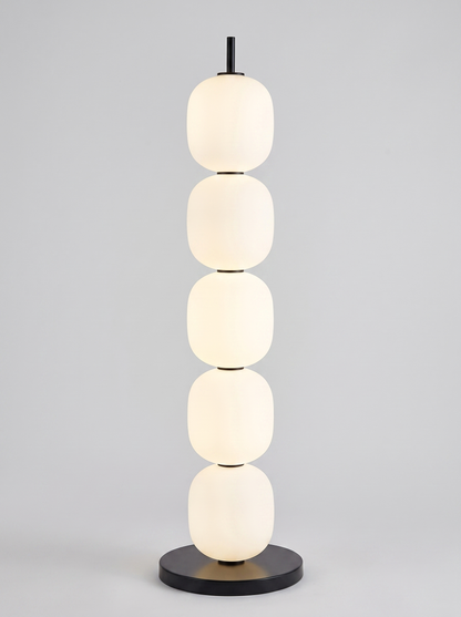 Sasso stacked opal glass floor lamp on light grey studio background