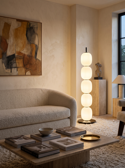 Sasso floor lamp beside a boucle sofa in a contemporary living room