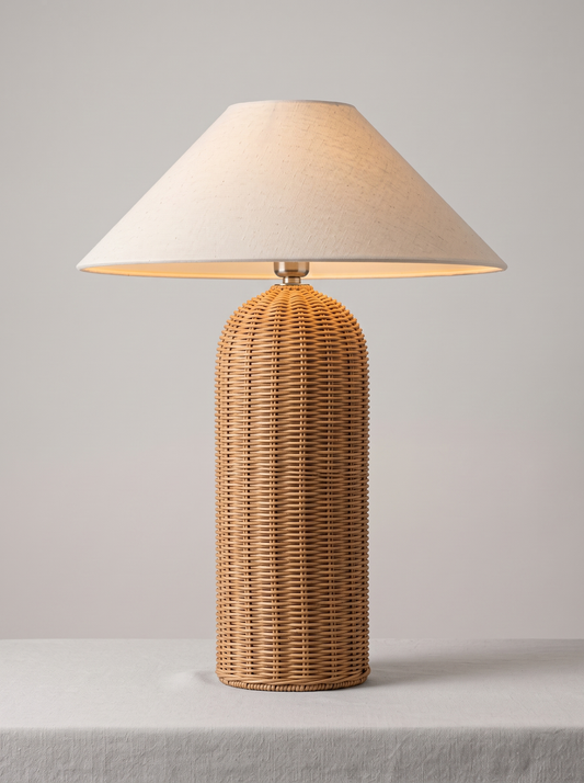 Rina hand-woven rattan table lamp on light grey studio background