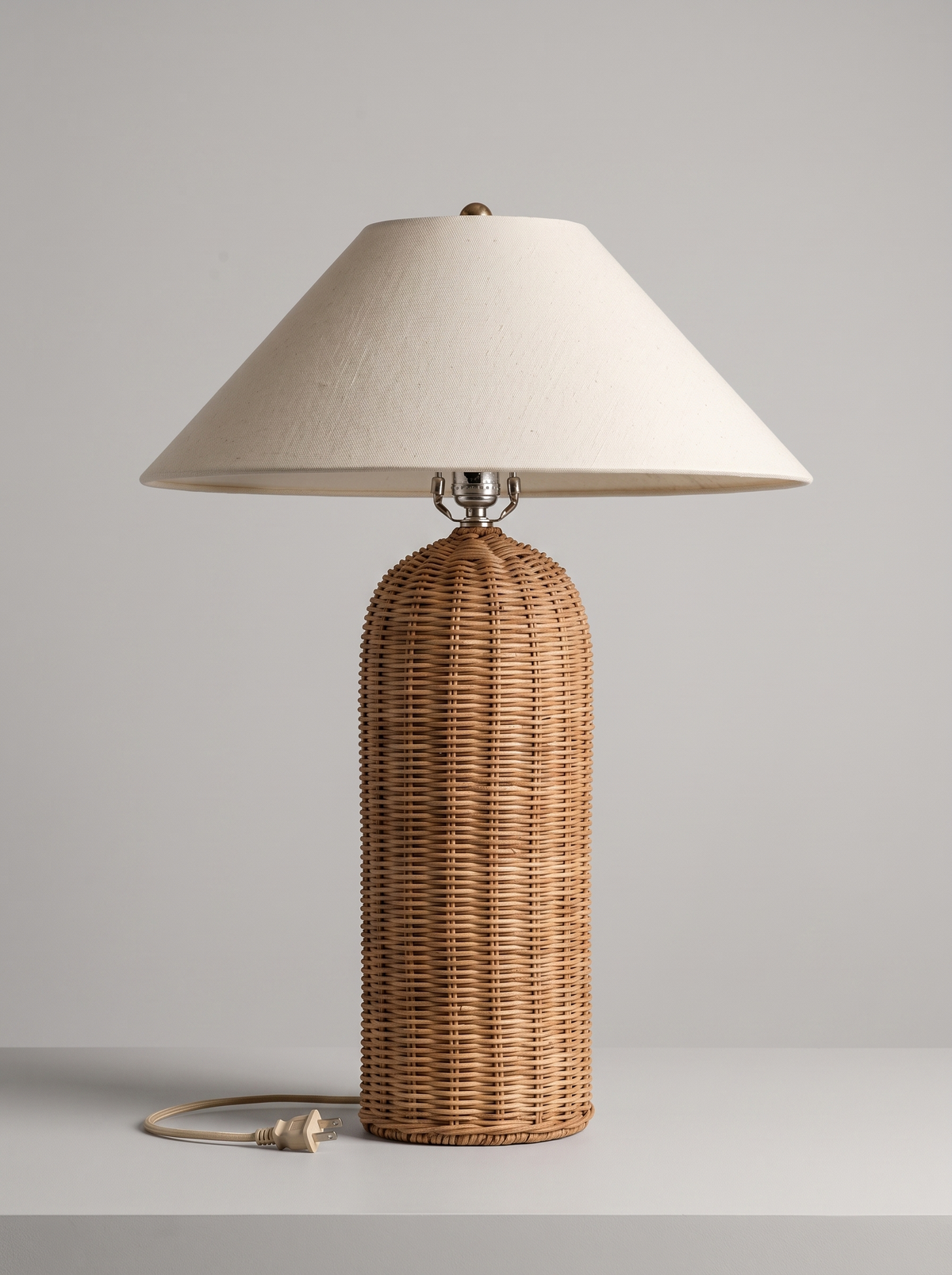 Rina rattan table lamp unlit, three-quarter studio view